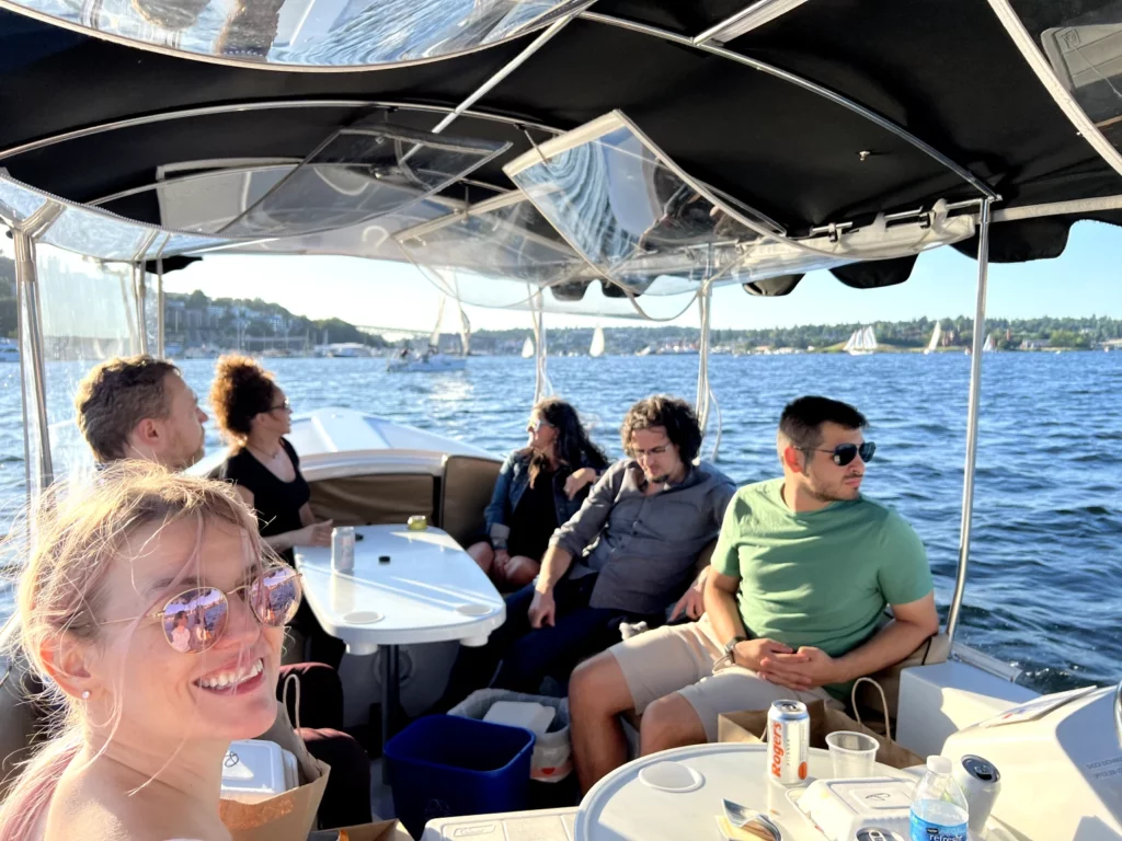 The Evocalize team at a summer boat party