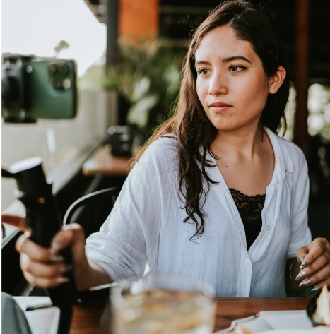 Influencer filming at a restaurant. 