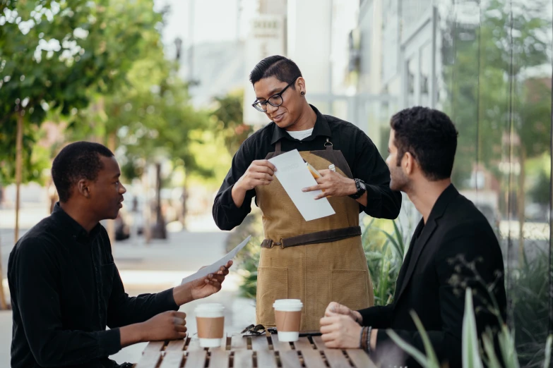 Waiter providing bill with review