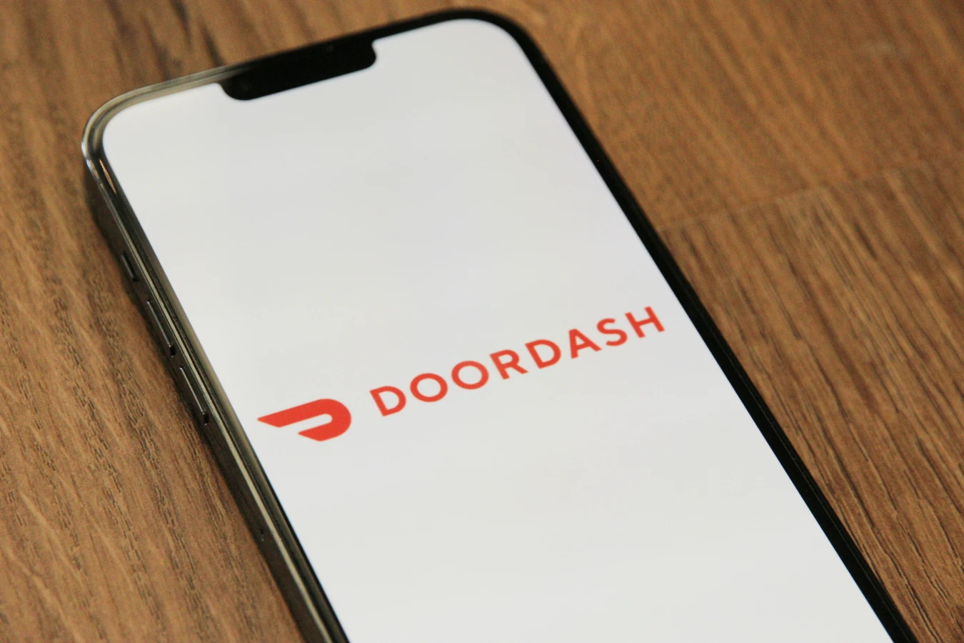 Science of restaurant pricing - Phone with Doordash app