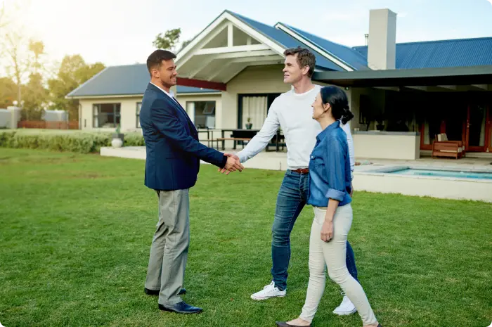 Couple meeting with real estate agent