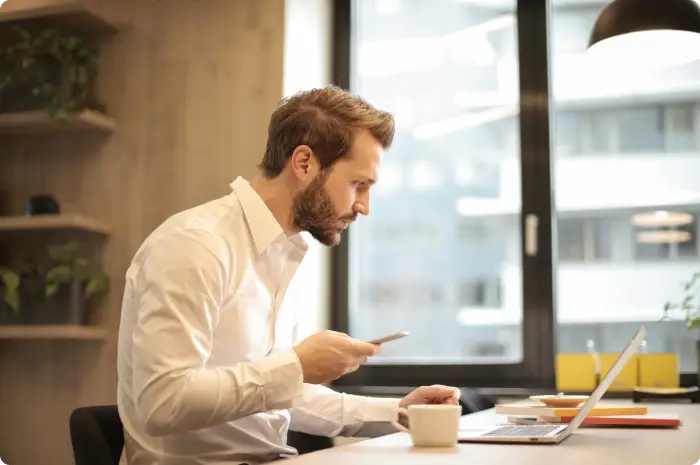 Man making a phone call to follow up on a lead