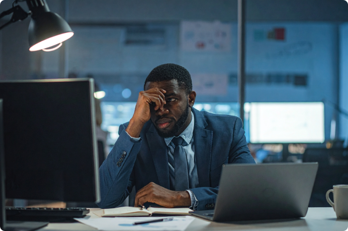 Marketing plan vs campaign for loan officers: Person on a computer feeling frustrated