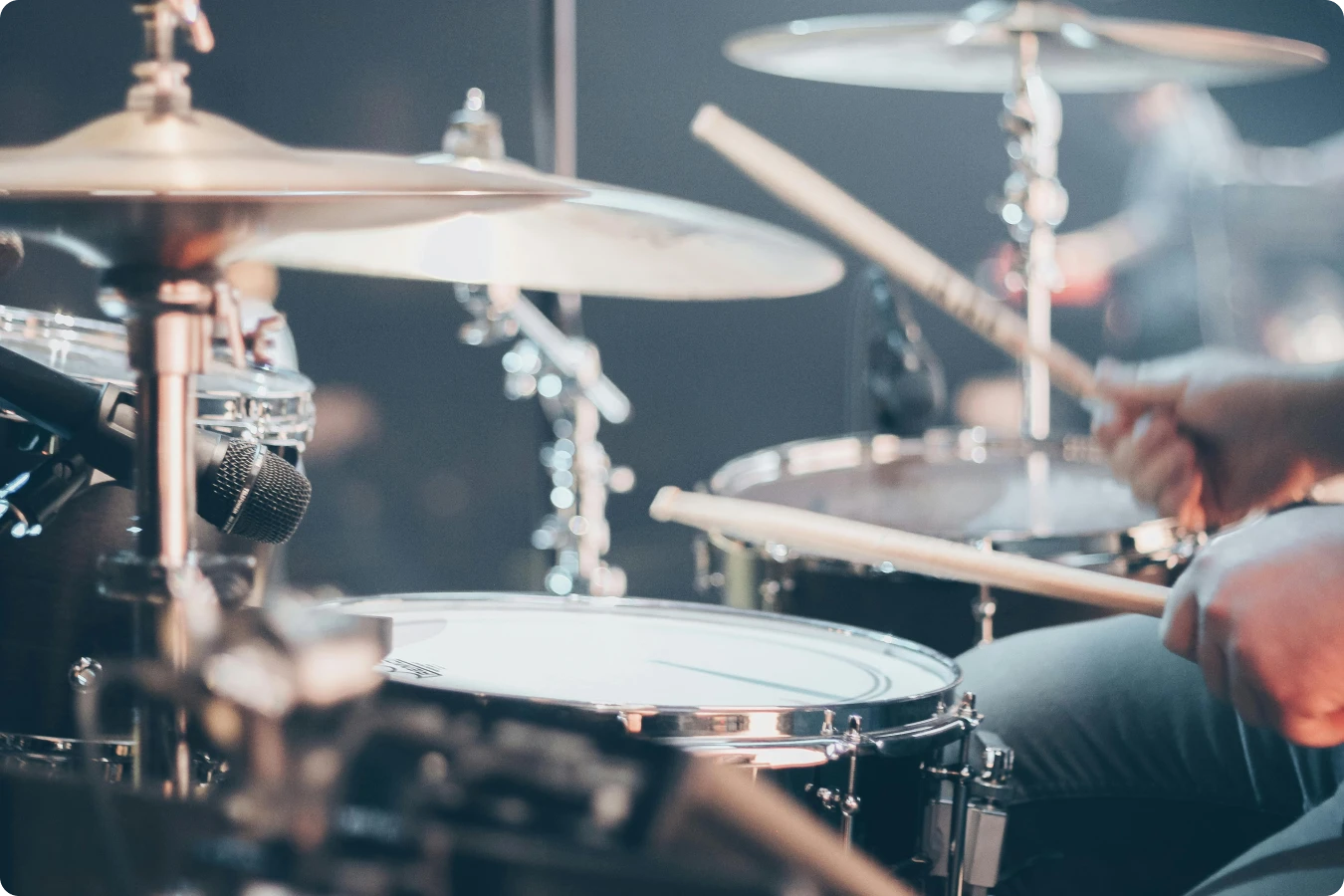 Person playing the drums: meaningful local connections